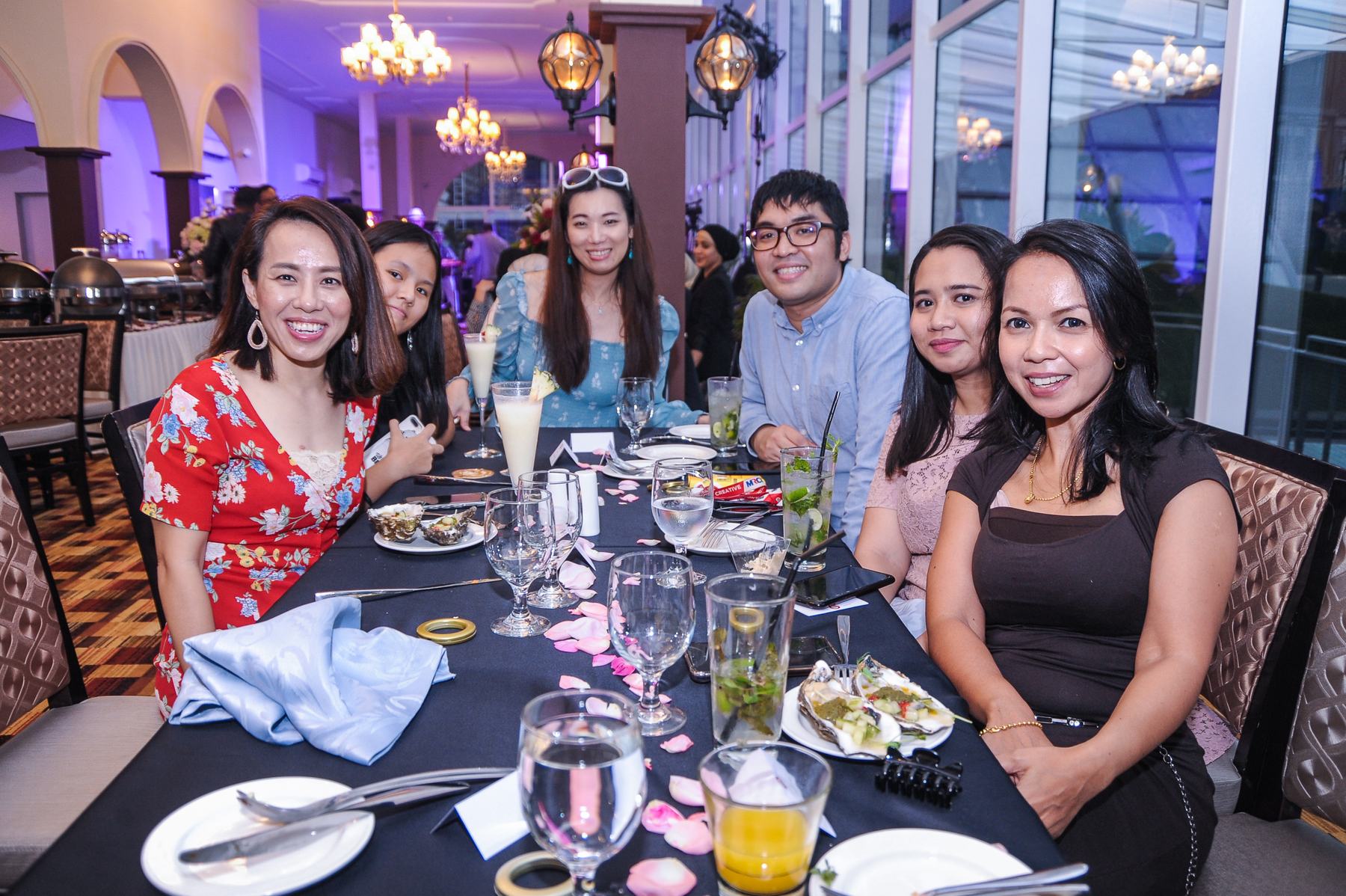 Friends celebrating at a long table