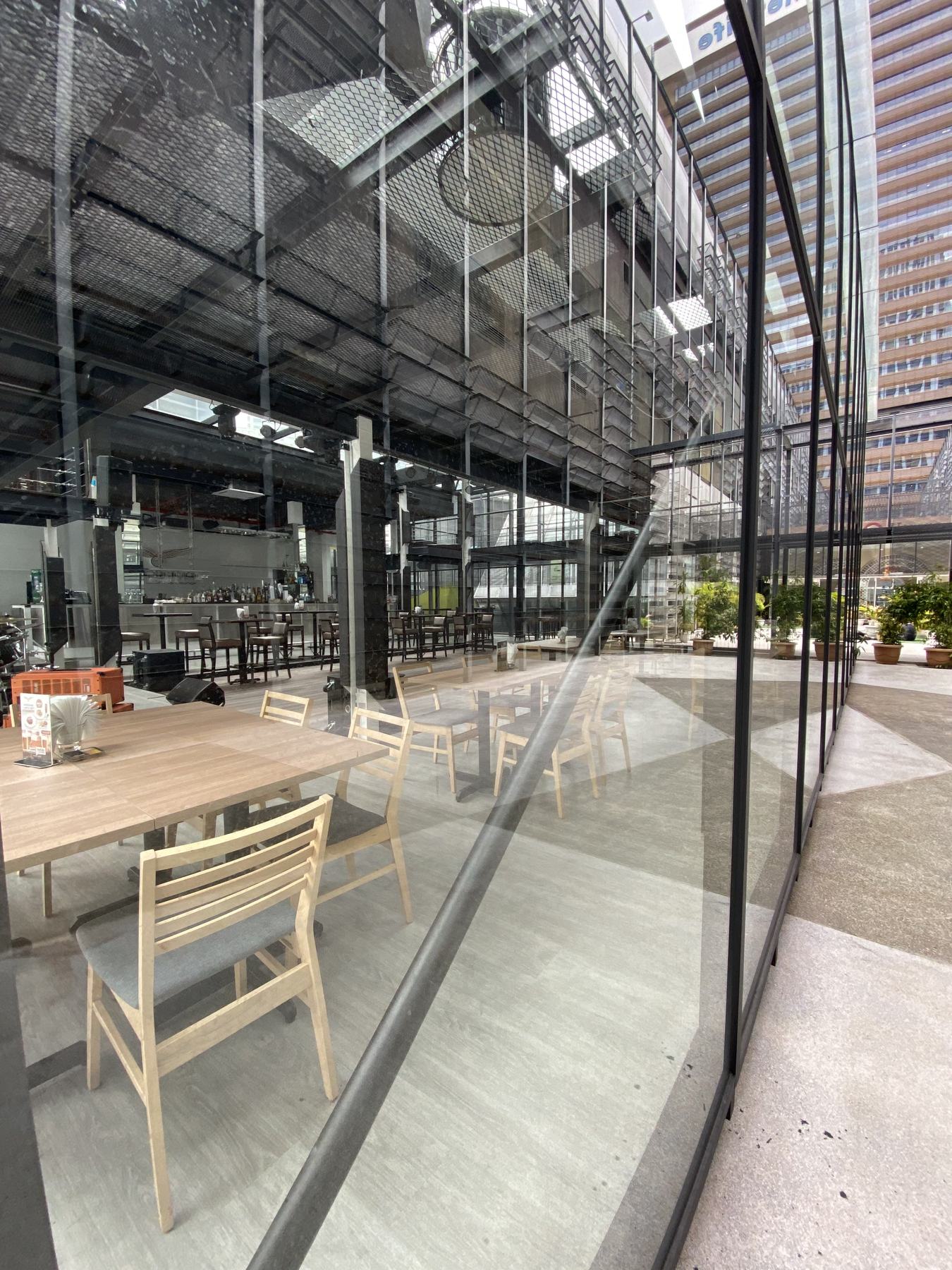 Glass pavilion edge with long banquet table inside