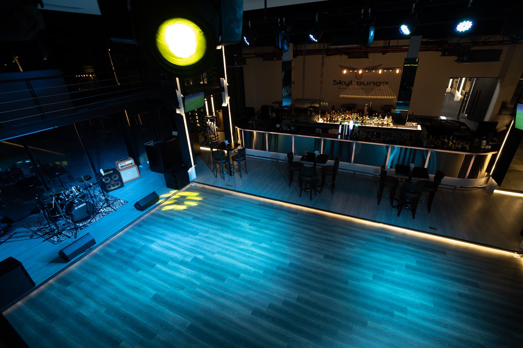 Dance floor and stage lit in blue
