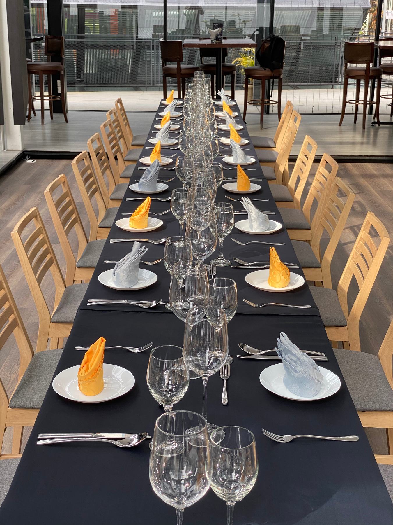Banquet table set with glassware