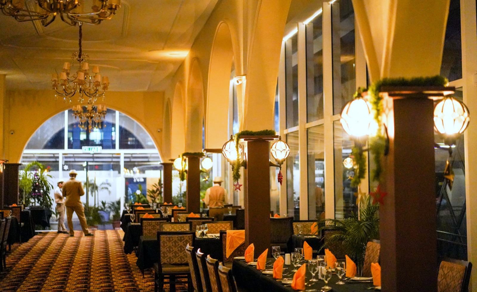 Chandeliers and arched windows in the dining hall